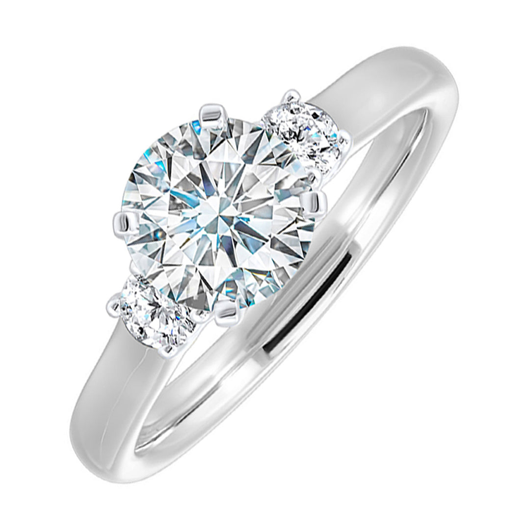 Classic and romantic, this three stone engagement ring features the bold gold shank to sparkle your moments further.