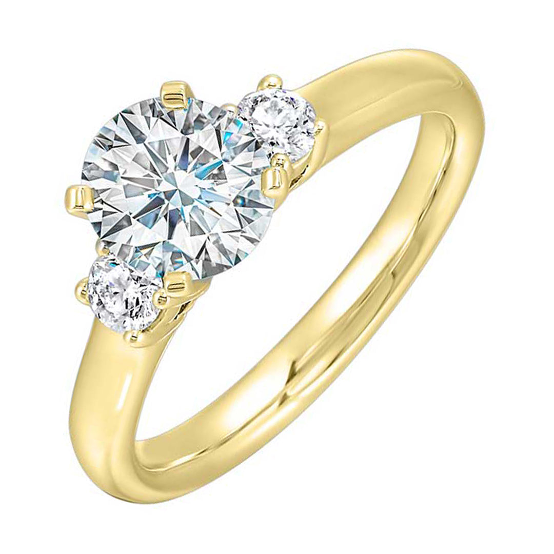 Classic and romantic, this three stone engagement ring features the bold gold shank to sparkle your moments further.