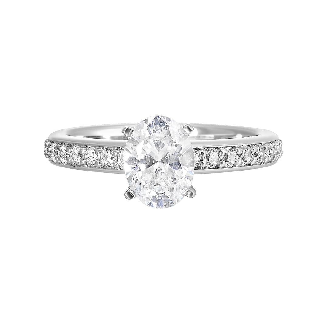 Sleek and beautiful, this diamond engagement ring set with pave diamonds complements the oval solitare.