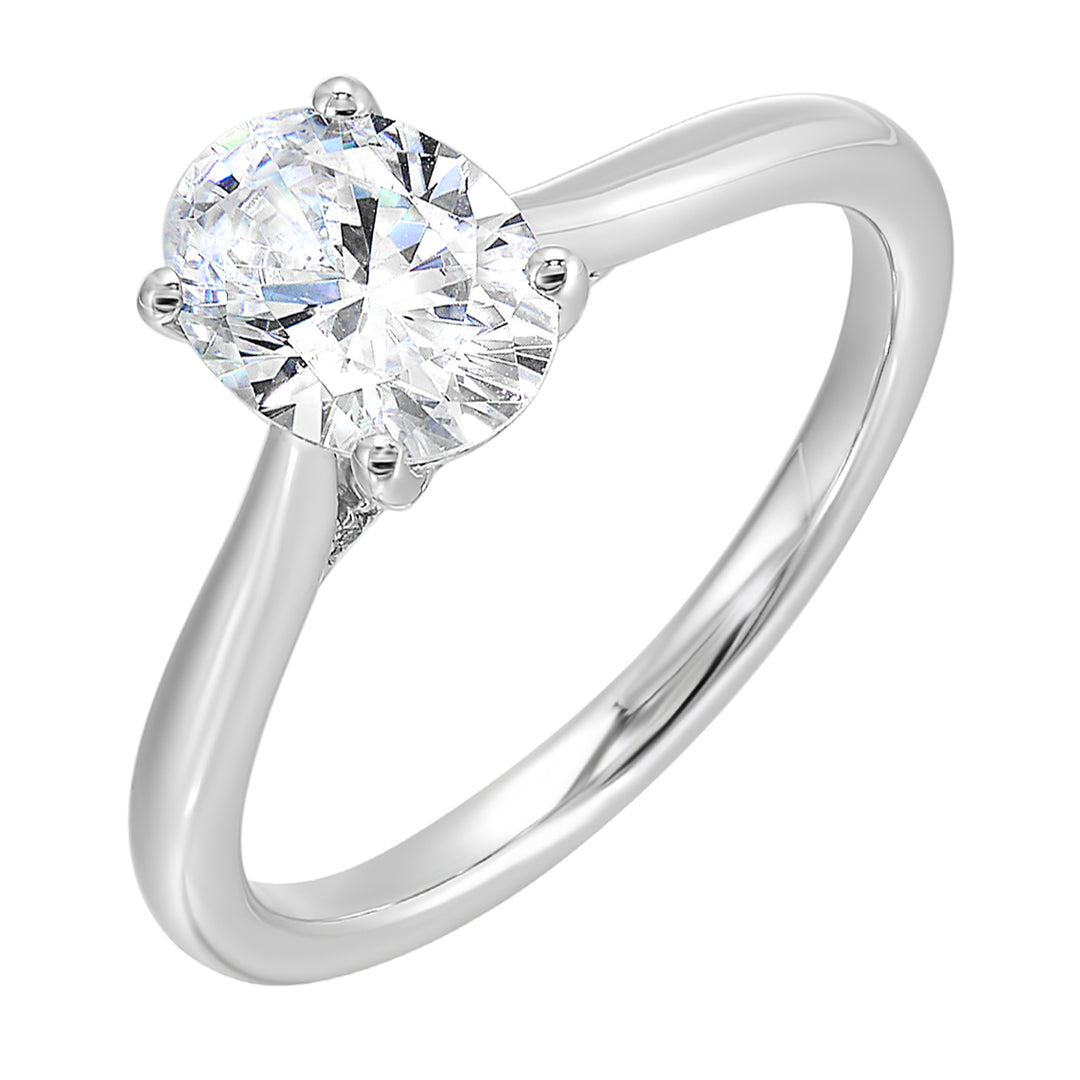 Effortless and classy this dazzling four prong oval solitaire ring features a clean, classic look with a sleek band.