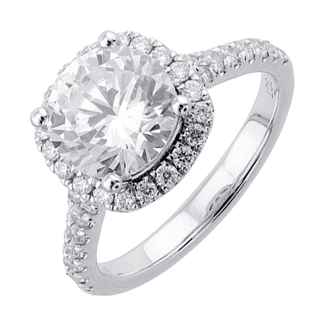 Sparkling cushion halo features beautiful set pav? diamonds that encircle the center solitare and adorn the band.