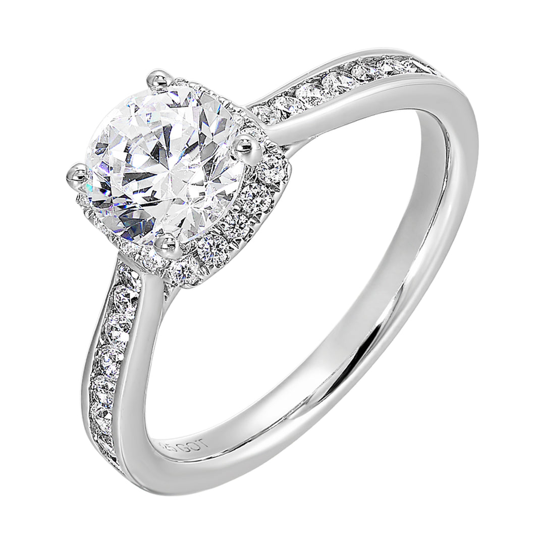 Cushion diamond halo engagement ring with a channel set diamond band is the perfect representation of high end elegance.