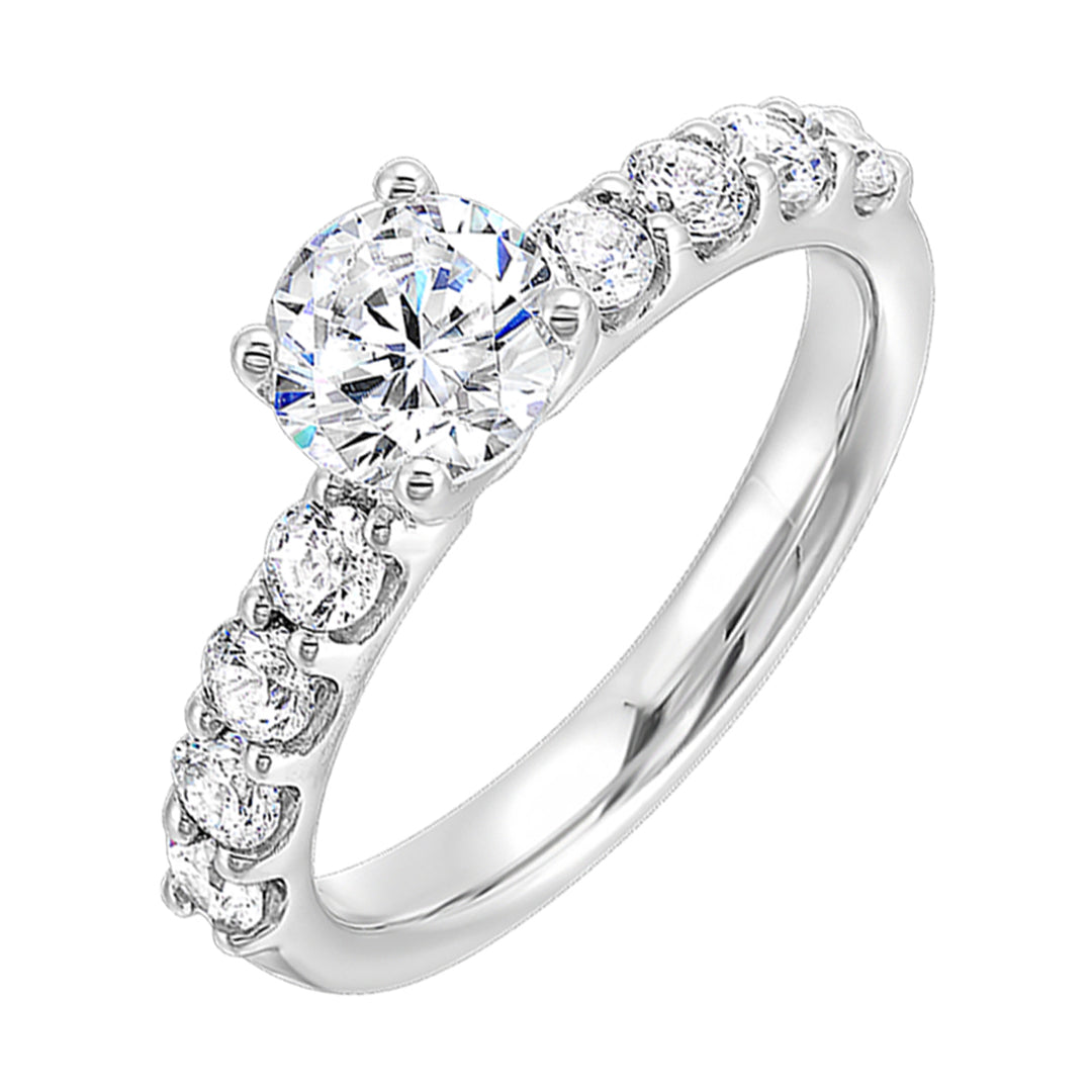 Bigger round diamonds rest on either side of this solitare engagement ring, creating a modern yet timeless look.