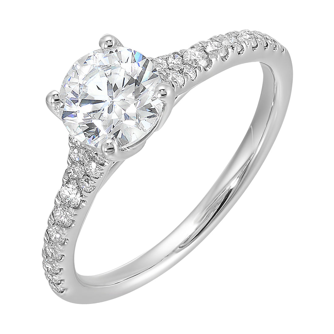 Defined by a tapered shank set with graduated round diamonds, this classic solitaire engagement ring is a classy choice