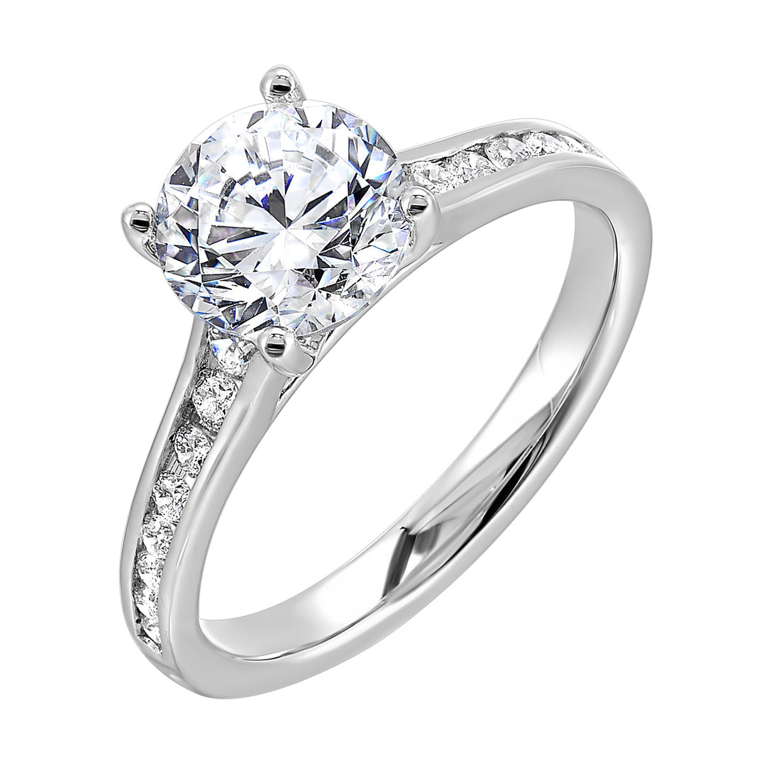 The simplicity of this single row channel set diamond shank engagement ring with four prong solitare is simply gorgeous.