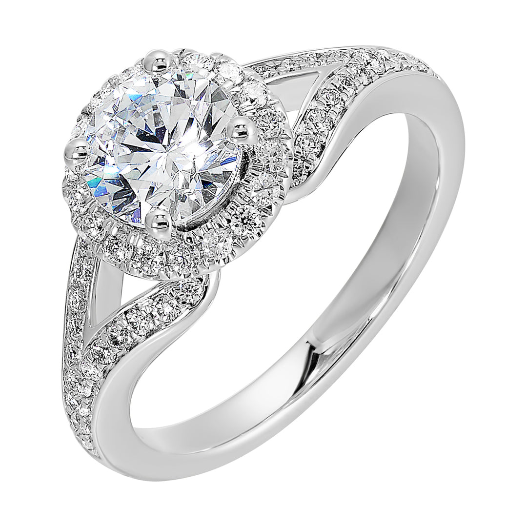 Halo engagement ring features an art deco inspired split shank design with diamond pave and glamourous round halo.