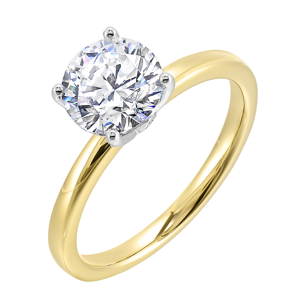 Engraved details flow towards a brilliant center solitare in this modern engagement ring.